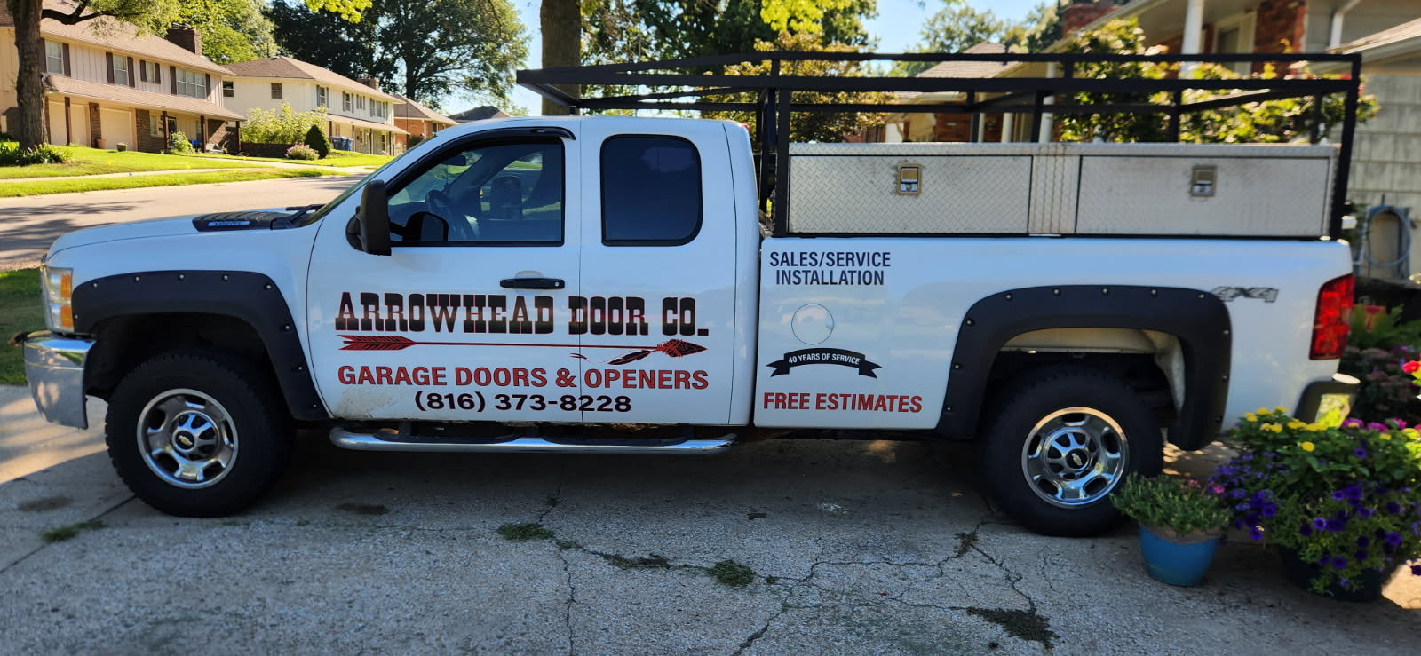 Professional garage door technician performing repair service